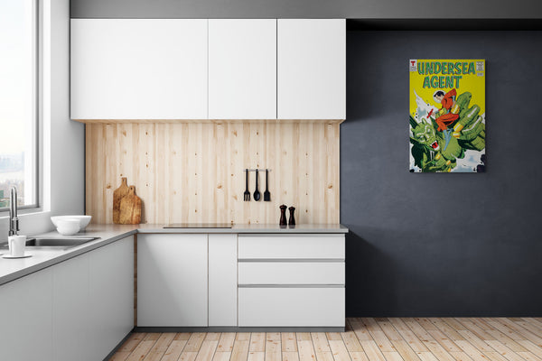 A large matte paper poster of the cover of the 1966 comic book "Undersea Agent #4" hung on a charcoal wall in a modern, bright kitchen with pine wood accents