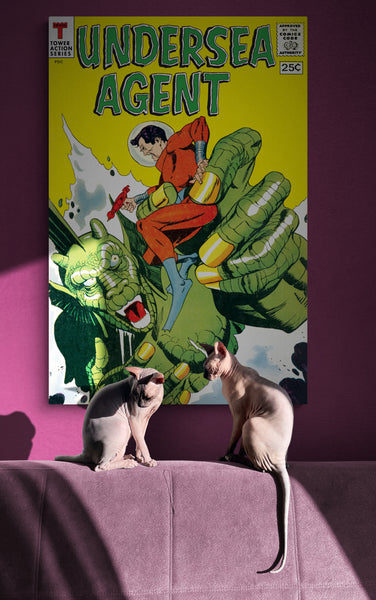 A large matte paper poster of the cover of the 1966 comic book "Undersea Agent #4", partially obscured by shadow, hung above two Sphynx cats lounging in the sunbeam