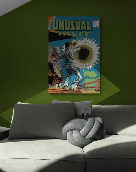 A large matte paper poster of the cover of the 1958 comic book "Unusual Tales #12", partially obscured by shadows, in a modern loft above a large grey couch